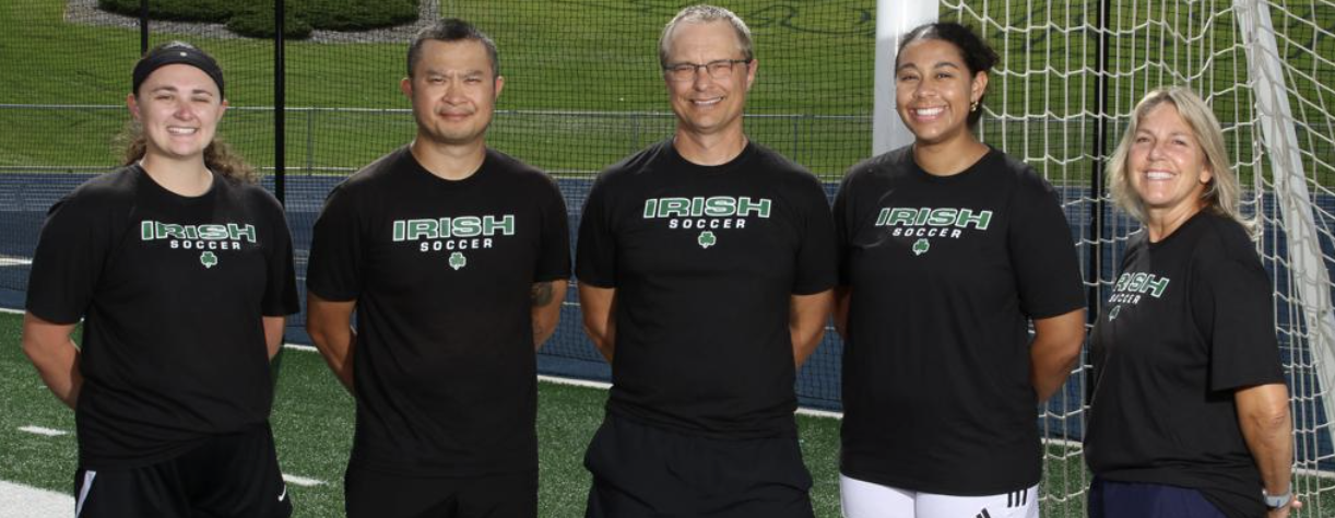 Rosemount Girls Soccer coaching staff together on the field