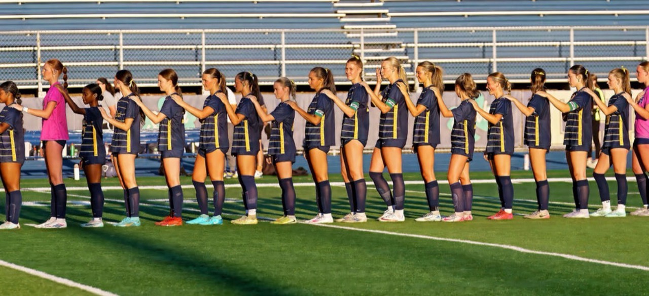 Rosemount Girls Soccer players lined up together on the field