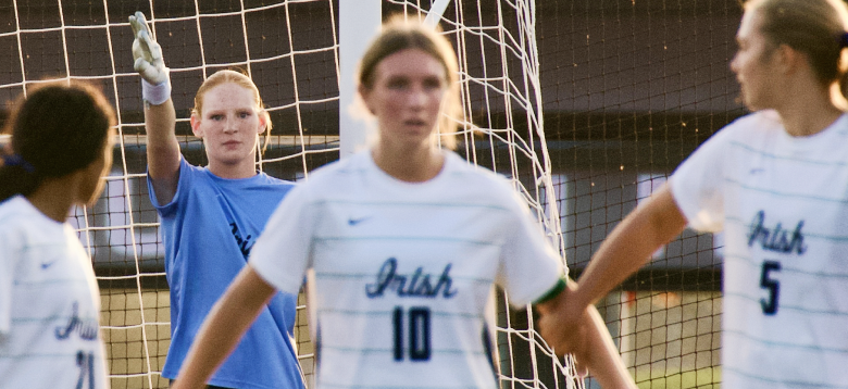 Rosemount players defending their goal at Irish Stadium